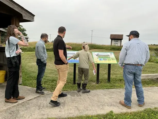 Boralex team members learning more about the grasslands and discussing where the walk would take place and what species might be seen